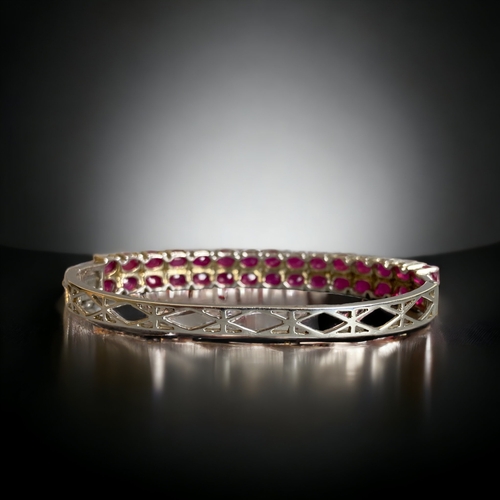 111 - A STERLING SILVER, PINK SAPPHIRE & DIAMOND LADIES BRACELET.