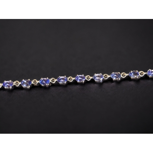 114 - A STERLING SILVER & TANZANITE LADIES BRACELET.
7.5