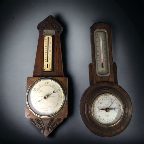 37 - A PAIR OF CARVED OAK BAROMETERS, 20TH CENTURY
