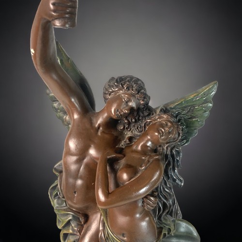 289 - A LARGE BRONZE FINISH RESIN TABLE LAMP. DEPICTING DRAPED EMBRACING COUPLE. PAINTED RESIN. 
63CM TALL