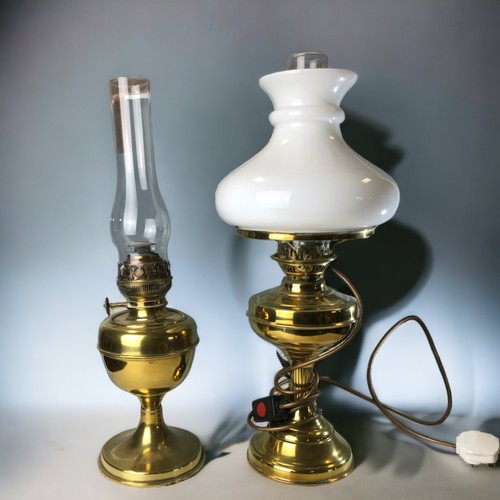 290 - 2 BRASS OIL LAMPS AND FUNNELS, (1 CONVERTED TO ELECTRIC) WITH A TURNED WOODEN TABLE LAMP