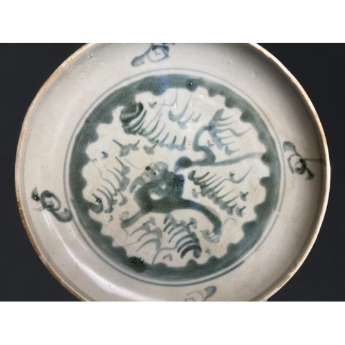 213 - A Chinese Nanking cargo blue & white dish.
Qianlong period, C1750.
Hand painted with a Dragon amongs... 