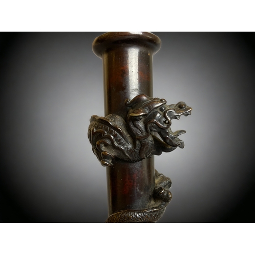 235 - A JAPANESE BRONZE MOON FLASK FORM VASE. 
MEIJI PERIOD. 
DECORATED WITH RELIEF LION (SHISHA), STYLISE... 