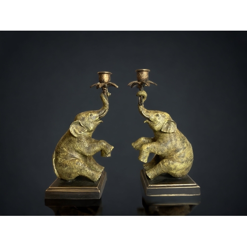 171 - A FINE PAIR OF AUSTRIAN CAST BRONZE ELEPHANT CANDLESTICKS. DEPICTING A PAIR OF SEATED ELEPHANT'S HOL... 