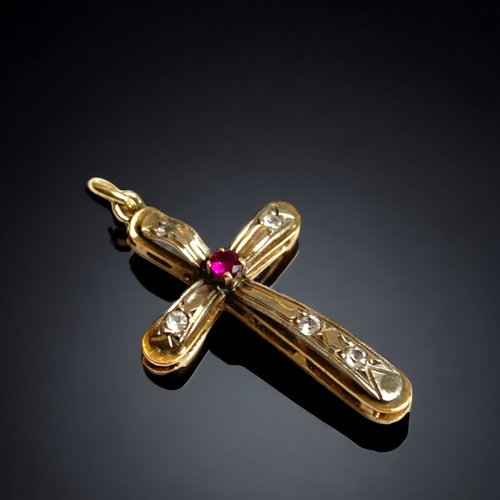 127 - AN ANTIQUE 9 CARAT GOLD AND GEM SET CRUCIFIX.
UNMARKED (TESTS AS 9CT GOLD). GEM SET.
30MM LONG
1.9G