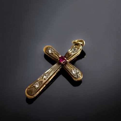 127 - AN ANTIQUE 9 CARAT GOLD AND GEM SET CRUCIFIX.
UNMARKED (TESTS AS 9CT GOLD). GEM SET.
30MM LONG
1.9G