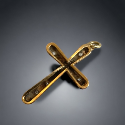 127 - AN ANTIQUE 9 CARAT GOLD AND GEM SET CRUCIFIX.
UNMARKED (TESTS AS 9CT GOLD). GEM SET.
30MM LONG
1.9G