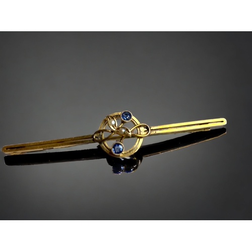 129 - A 9 CARAY GOLD, TANZANITE & SEED PEARL LADIES BROOCH.
57MN LONG
2.8 GRAMS