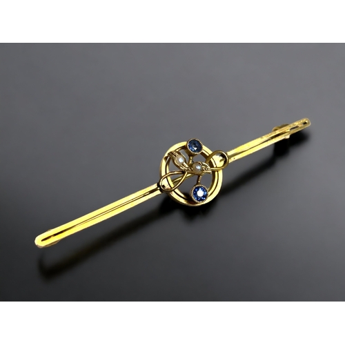 129 - A 9 CARAY GOLD, TANZANITE & SEED PEARL LADIES BROOCH.
57MN LONG
2.8 GRAMS