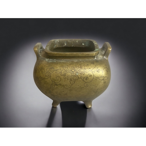 264 - A CHINESE BRONZE CENSER. WITH GOLD INLAY . 
QING DYNASTY.
DECORATED WITH FOLIATE DESIGNS. 
7.5 X 9 C... 