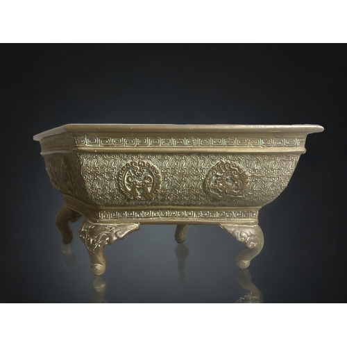 265 - A CHINESE BRONZE BONSAI PLANTER.
SCARCE SHAPE, STYLISED PATTERN WITH RELIEF DRAGON MEDALLIONS. 
SIGN... 