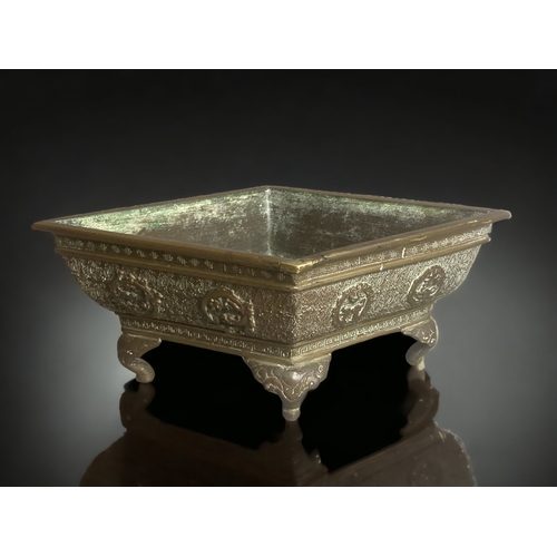 265 - A CHINESE BRONZE BONSAI PLANTER.
SCARCE SHAPE, STYLISED PATTERN WITH RELIEF DRAGON MEDALLIONS. 
SIGN... 