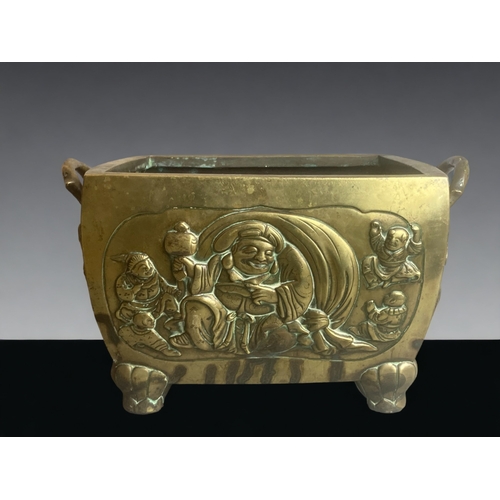 266 - A LARGE & HEAVY CHINESE BRONZE PLANTER.
DEPICTING BUDDHA & FIVE PLAYING CHILDREN TO ONE SIDE, AND MO... 