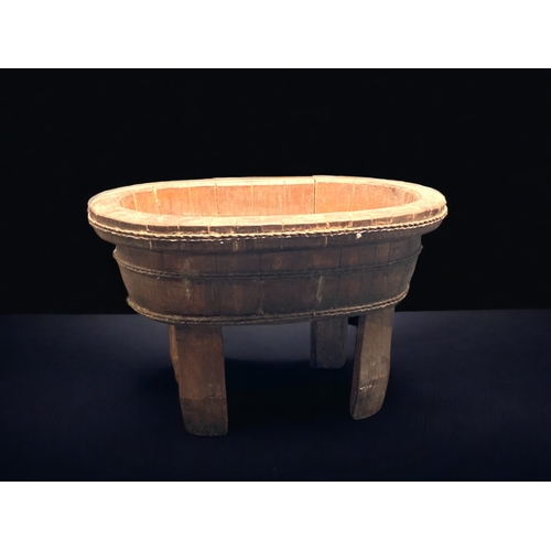 9 - A CHINESE STAINED PINE FOOTED RICE BOWL / CONTAINER. 
51CM WIDE.