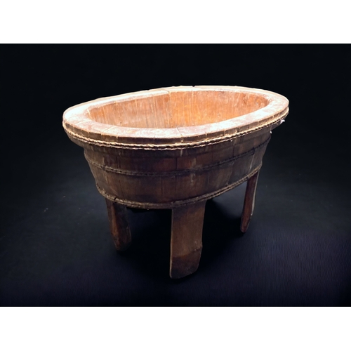 9 - A CHINESE STAINED PINE FOOTED RICE BOWL / CONTAINER. 
51CM WIDE.
