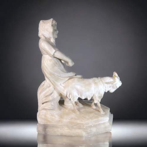 180A - AN ITALIAN CARVED MARBLE STATUE. DEPICTING A YOUNG FARM GIRL AND A GOAT.  SAT ON AN ALABASTER BASE. ... 