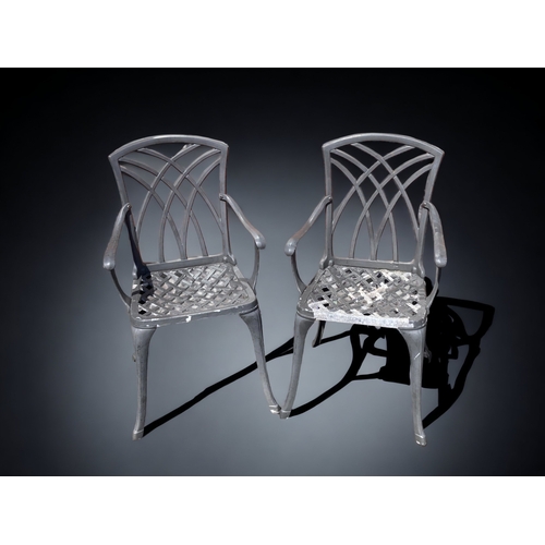 383 - A PAIR OF GREY CAST METAL GARDEN CHAIRS.