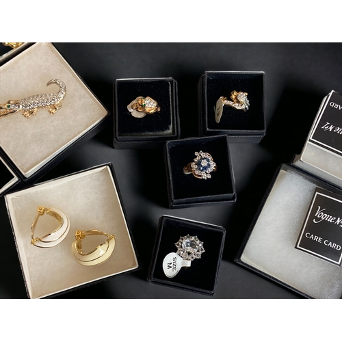 69 - A COLLECTION OF 17 BOXED VOGUE NO.1 JEWELLERY. INCLUDING BRACELET, RINGS, BROOCHES & EARRINGS.