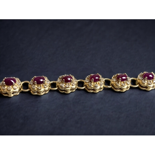 73 - A 925 STERLING GILT SILVER LADIES RUBY & DIAMOND BRACELET. 
20.5CM LONG