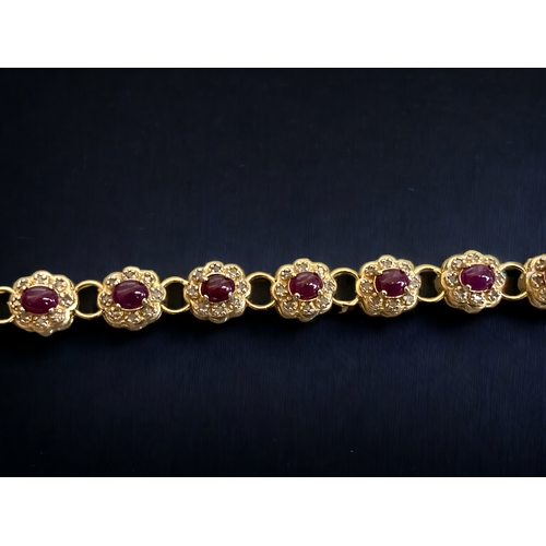 73 - A 925 STERLING GILT SILVER LADIES RUBY & DIAMOND BRACELET. 
20.5CM LONG