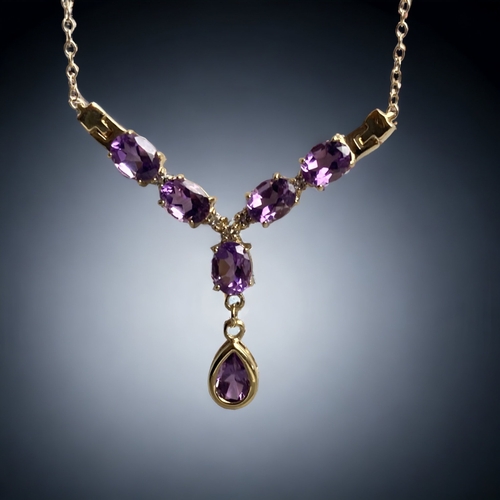 75 - A LADIES 925 SILVER GILT & AMETHYST NECKLACE.