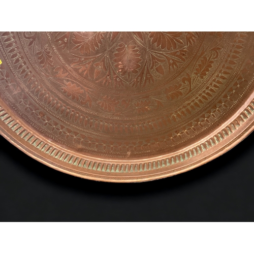 382 - A HUGE PERSIAN QAJAR ENGRAVED COPPER FEAST SERVING TRAY. DECORATED WITH CONCENTRIC STYLISED FOLIATE ... 