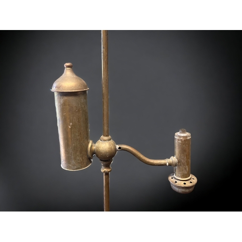 389 - A VICTORIAN BRASS 'STUDENTS' OIL LAMP.
72CM TALL.