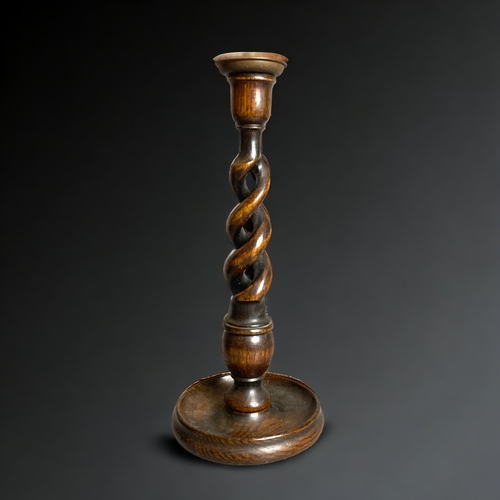 370 - A PAIR OF EARLY 20TH CENTURY WOODEN BARLY TWIST CANDLESTICKS. 
31.5CM TALL