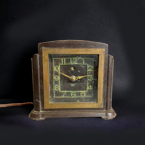 297 - A BAKELITE ART DECO ELECTRIC MANTLE CLOCK, TOGETHER WITH A SIMILAR METAMEC EXAMPLE.