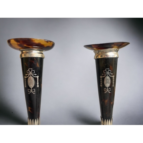 91 - A FINE QUALITY PAIR OF SILVER & TORTOISESHELL CANDLESTICKS.
BY WILLIAM COMYNS & SONS. 
INLAID RIBBON... 