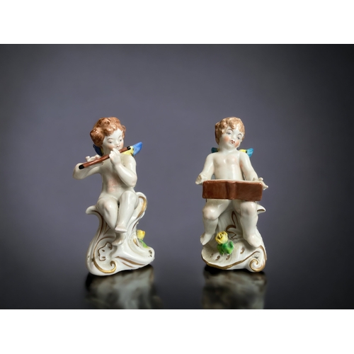 224 - A SET OF FOUR DRESDEN PORCELAIN CHERUB BAND FIGURES. EACH PLAYING A MUSICAL INSTRUMENT. 
TALLEST STA... 