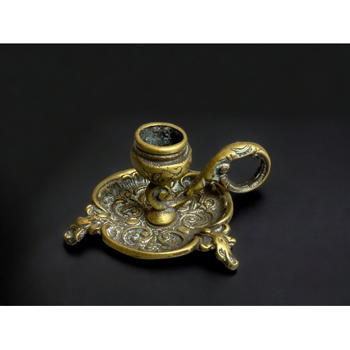 329 - A CONTINENTAL BRONZE CHAMBERSTICK.
6CM TALL