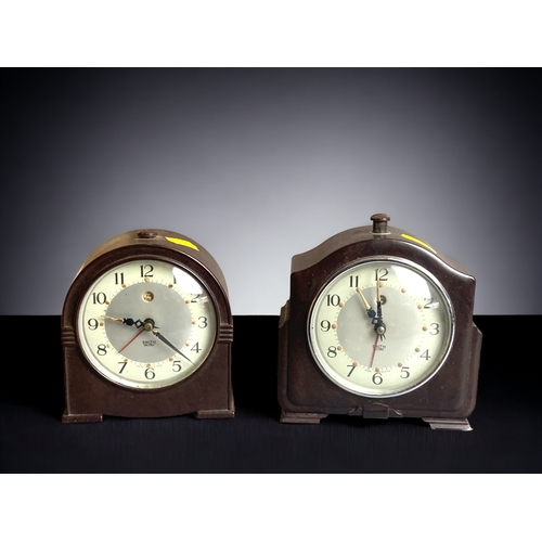 298 - THREE VINTAGE SMITHS ELECTRIC CLOCKS. INCLUDING A BRASS LANTERN AND TWO ART DECO BAKELITE EXAMPLES.