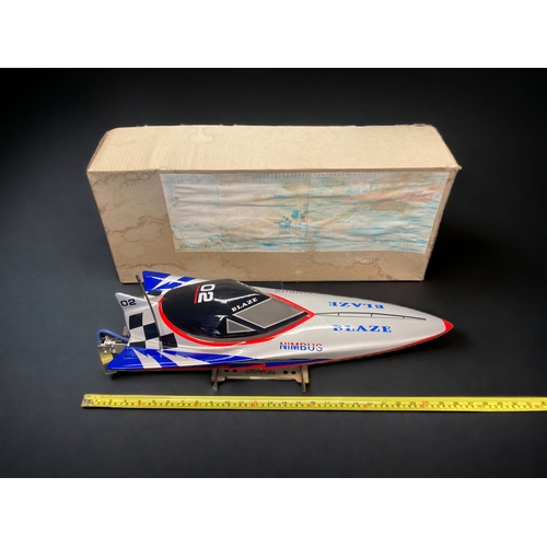 451 - A LARGE BOXED DRAGON BLAZE B-24 REMOTE CONTROL SPEED BOAT. 
65CM LONG.