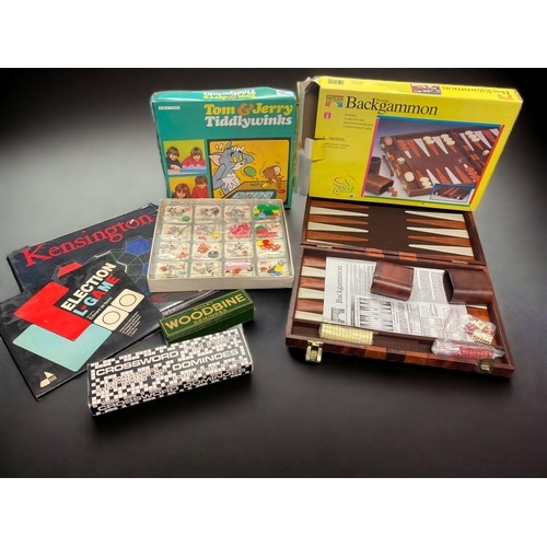 455 - A COLLECTION OF GAMES. INCLUDING TOM & JERRY TIDDLYWINKS, DOMINOES & BACKGAMMON.