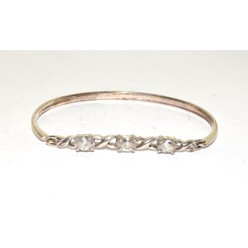 181 - 925 silver solid bangle with 3 stone decoration together a stone set similar bracelet