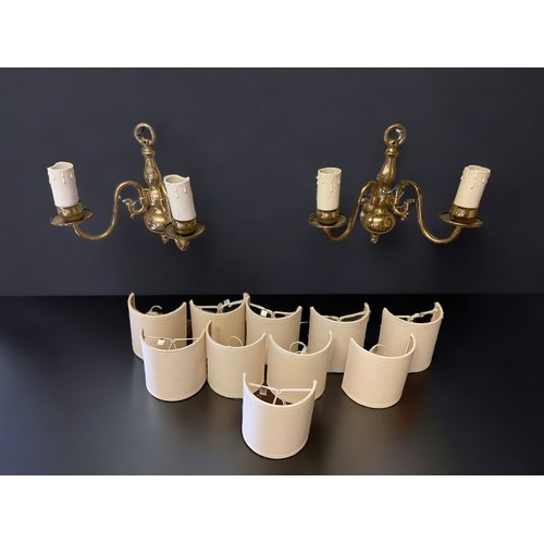 394 - A SET OF FIVE BRASS TWIN BRANCH WALL LIGHTS. 1ST-HALF 20TH CENTURY.
WITH SHADES.