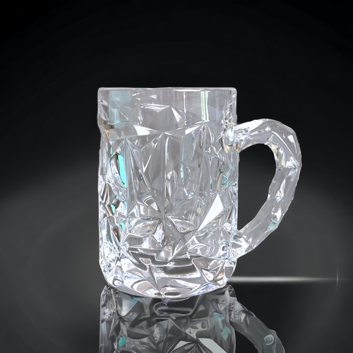 260 - A BOXED GLASS TIFFANY & CO BEER TANKARD.
12.5CM TALL