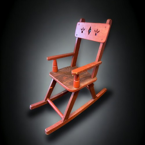 13 - A VINTAGE CHILDS ROCKING CHAIR.