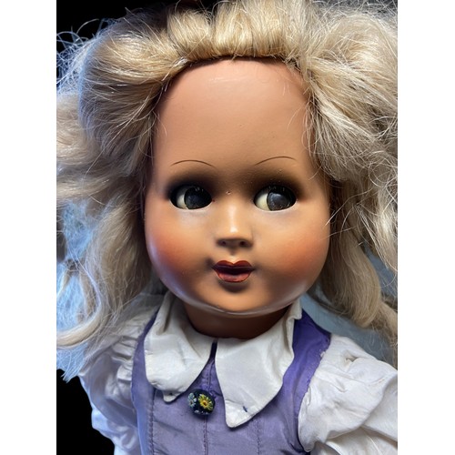 437 - A VINTAGE COMPOSITE DOLL.
WITH CRIER.