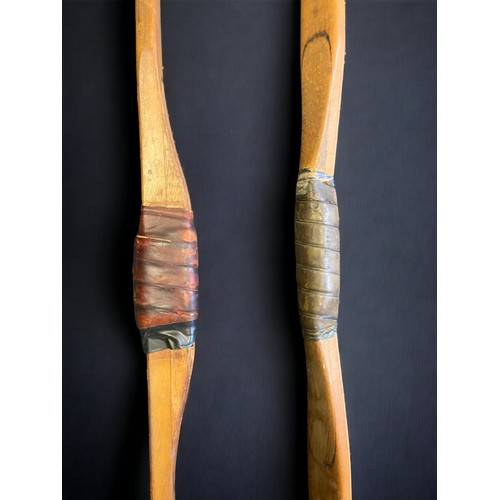 420 - TWO VINTAGE SLAZENGERS LONGBOWS.
38 & 32lbs.