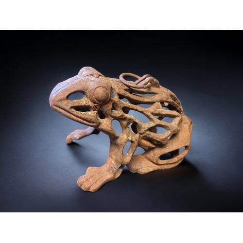 473 - A CAST IRON FROG CANDLE HOLDER 
10