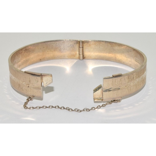 82 - 925 silver heavy gauge solid bangle with fitted safty chain