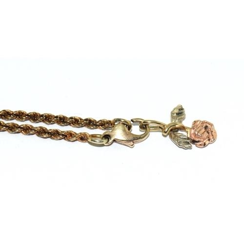 120 - A 9ct Gold Rope Bracelet and flower Charm. 4g