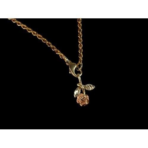 120 - A 9ct Gold Rope Bracelet and flower Charm. 4g