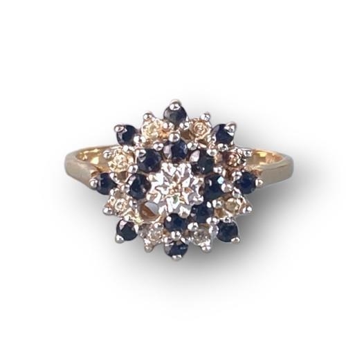 8 - 9ct gold ladies Sapphire and Diamond centre cluster ring size P