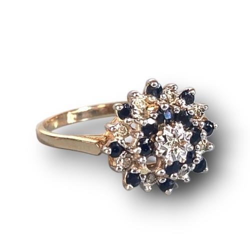 8 - 9ct gold ladies Sapphire and Diamond centre cluster ring size P