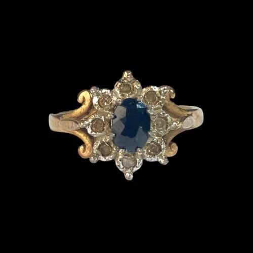 177 - A 9ct Gold Ladies Diamond & Sapphire Cluster Ring. H/M Dia in ring. Size M