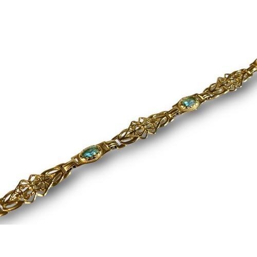 59 - A 9ct Gold Ladies Fancy Link Aquamarine Bracelet. Weight - 6g