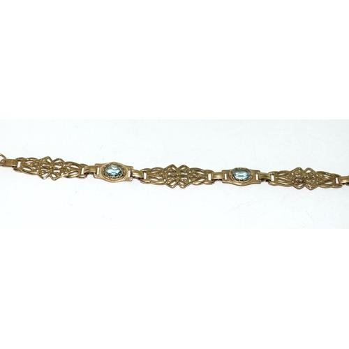 59 - A 9ct Gold Ladies Fancy Link Aquamarine Bracelet. Weight - 6g